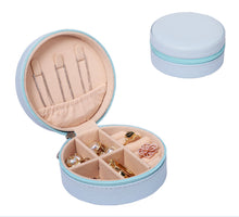 Load image into Gallery viewer, Open blue compact travel jewelry box with zip closure and velvet interior.