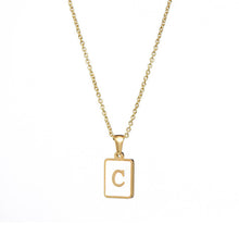 Load image into Gallery viewer, Gold initial necklace with the letter “C” on a mother of pearl pendant, hanging from a dainty gold chain, displayed on a white background.