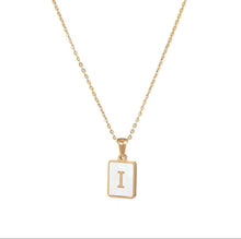 Load image into Gallery viewer, Gold initial necklace with the letter “I” on a mother of pearl pendant, hanging from a dainty gold chain, displayed on a white backgro